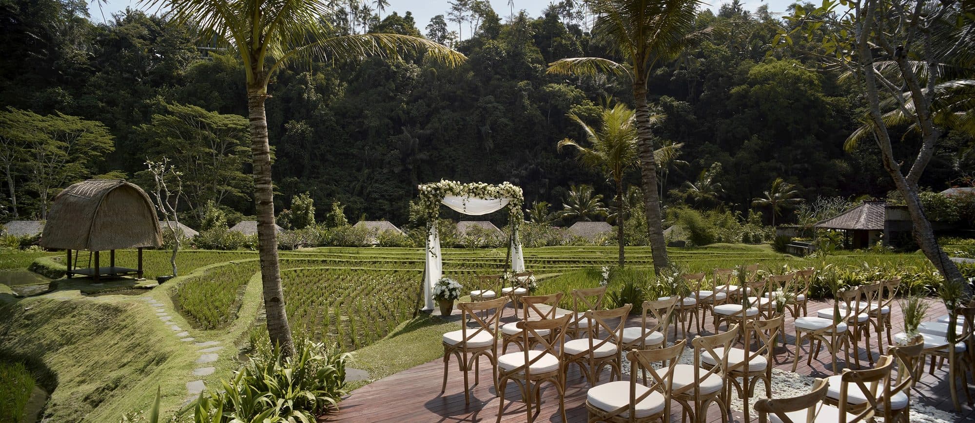 Mandapa, a Ritz-Carlton Reserve — a ceremony set on the deck overlooking the rice terraces · Ubud, Indonesia
