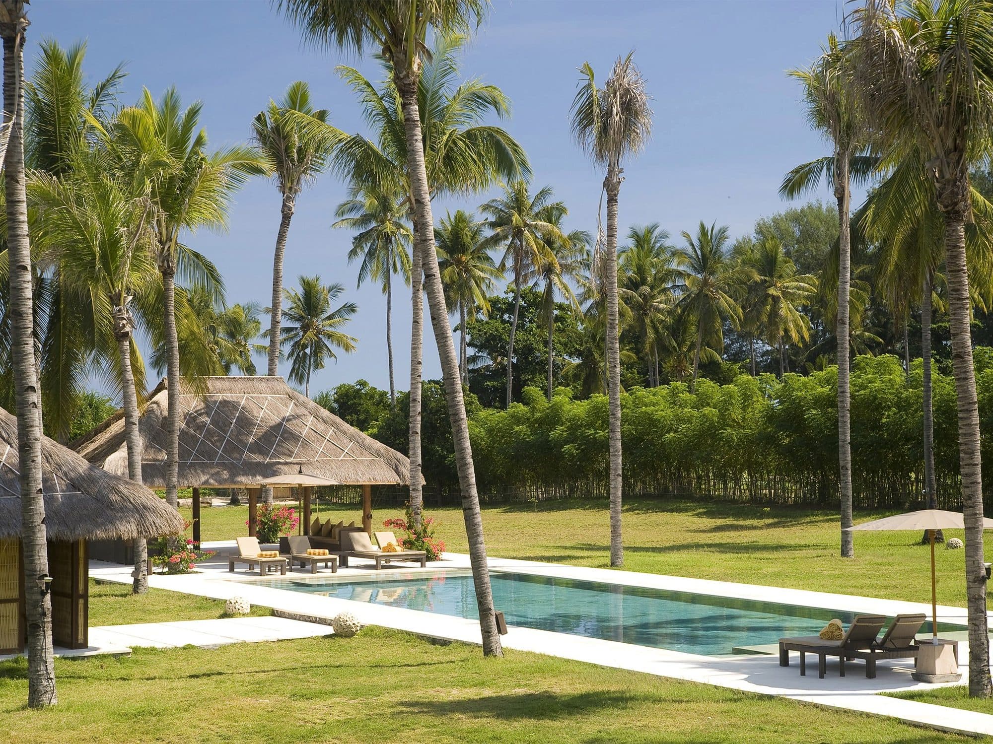 Sepoi Sepoi — the pool beside a thatched pavilion · Lombok, Indonesia