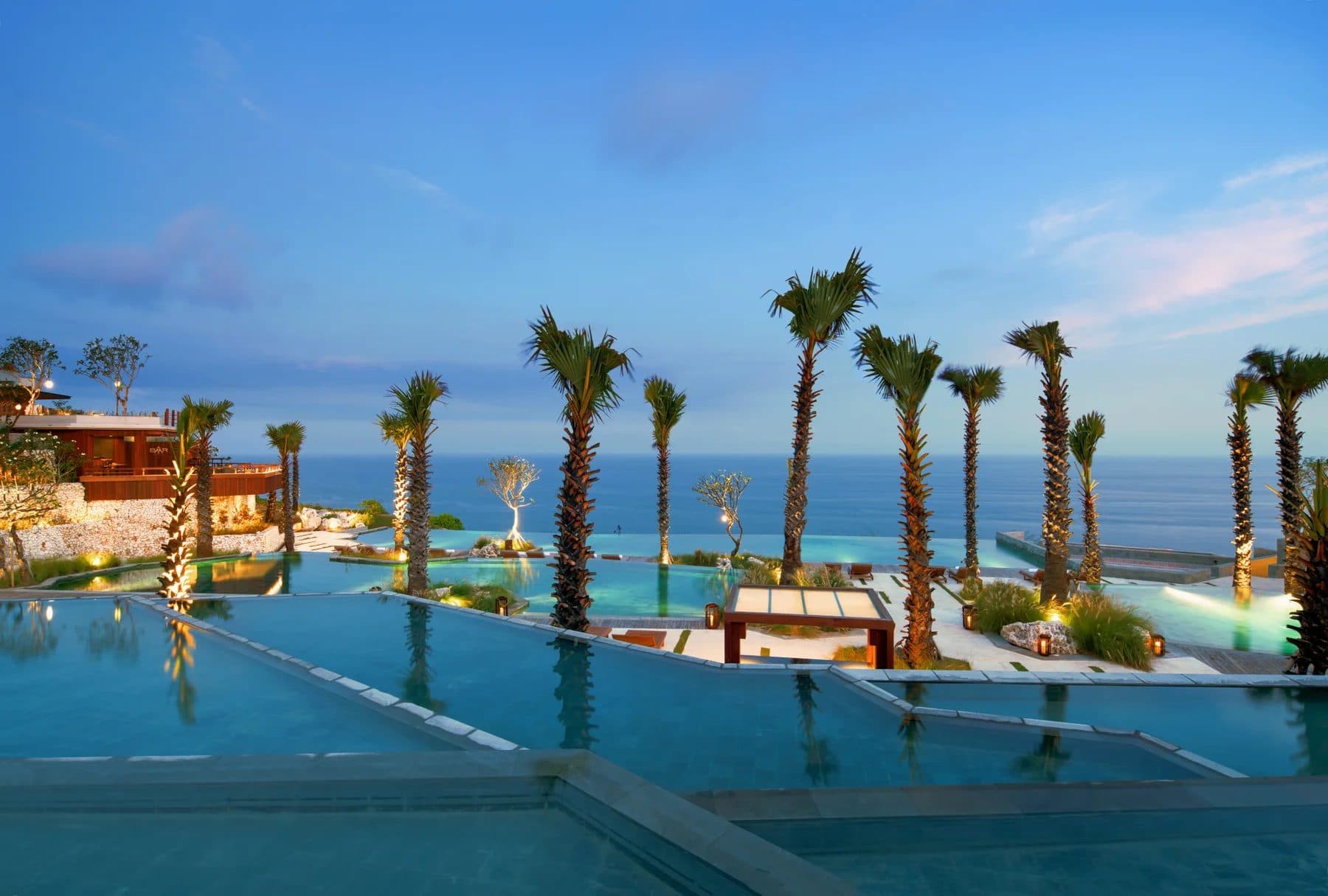 Six Senses Uluwatu — the terraced pools and palms above the ocean · Uluwatu, Indonesia