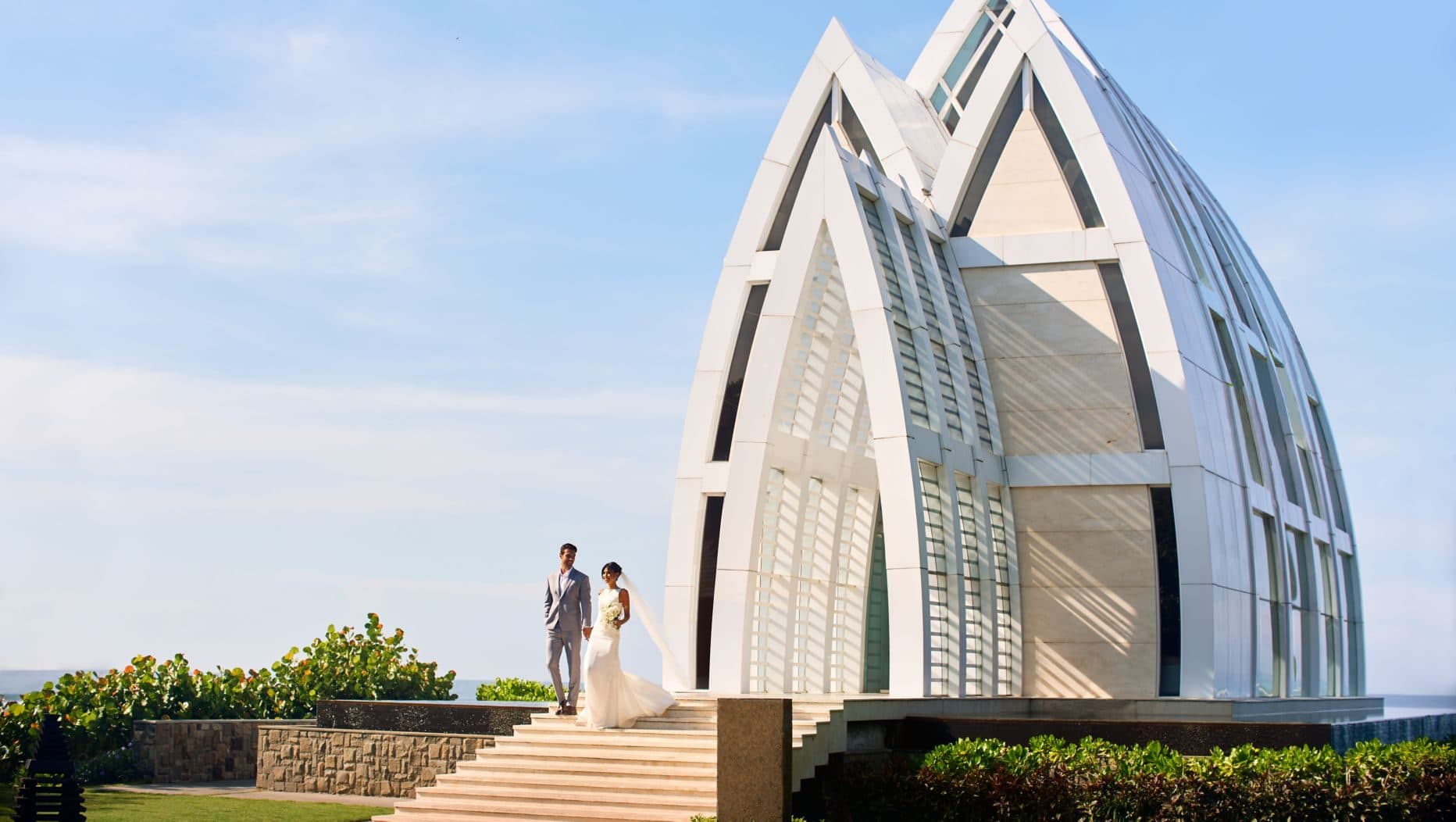 The Ritz Carlton Bali — a couple on the steps of the glass chapel · Nusa Dua, Indonesia