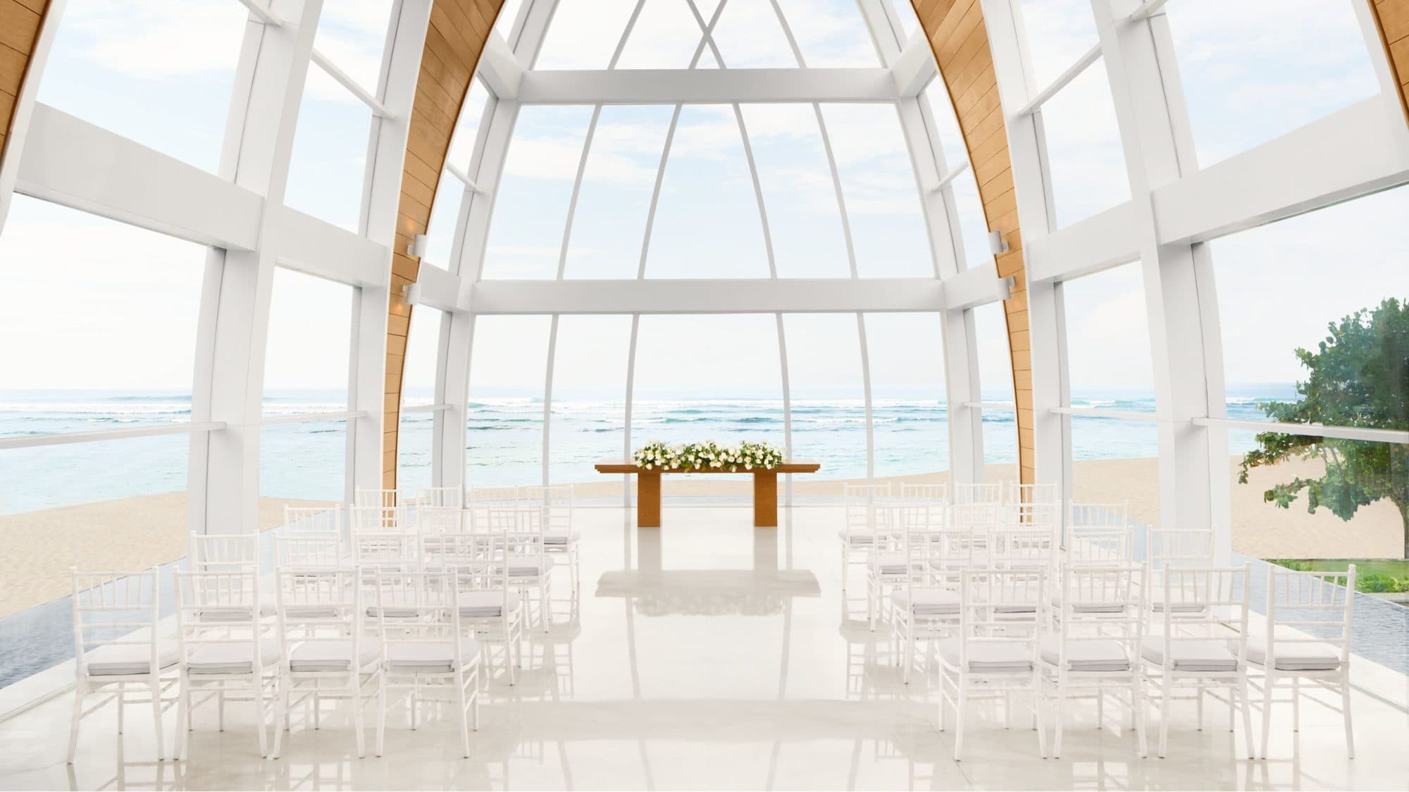 The Ritz Carlton Bali — inside the glass chapel, chairs facing the ocean · Nusa Dua, Indonesia