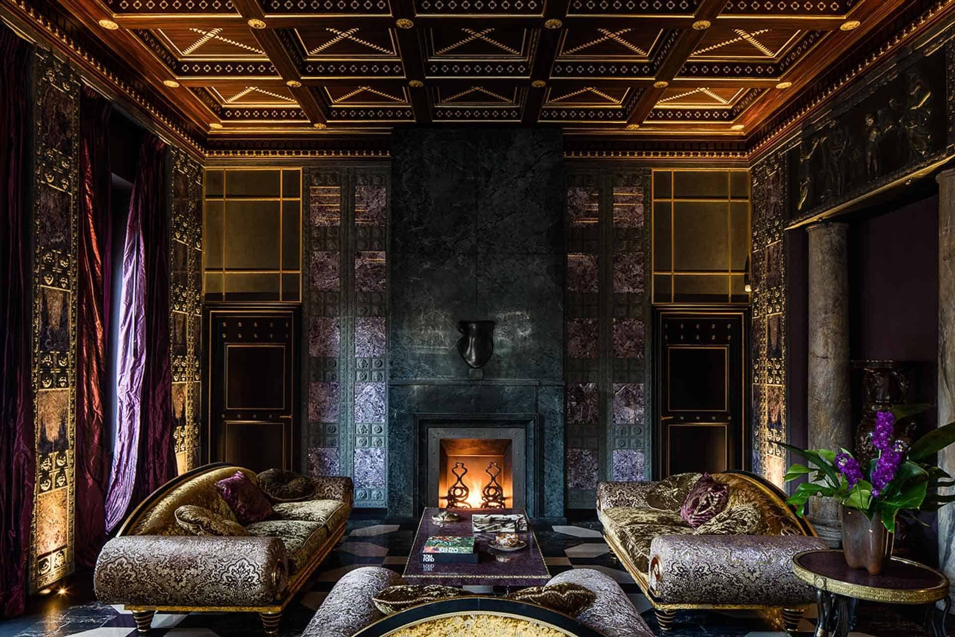 Villa Clara — a salon with a coffered ceiling, fireplace and gilded sofas · Rome, Italy