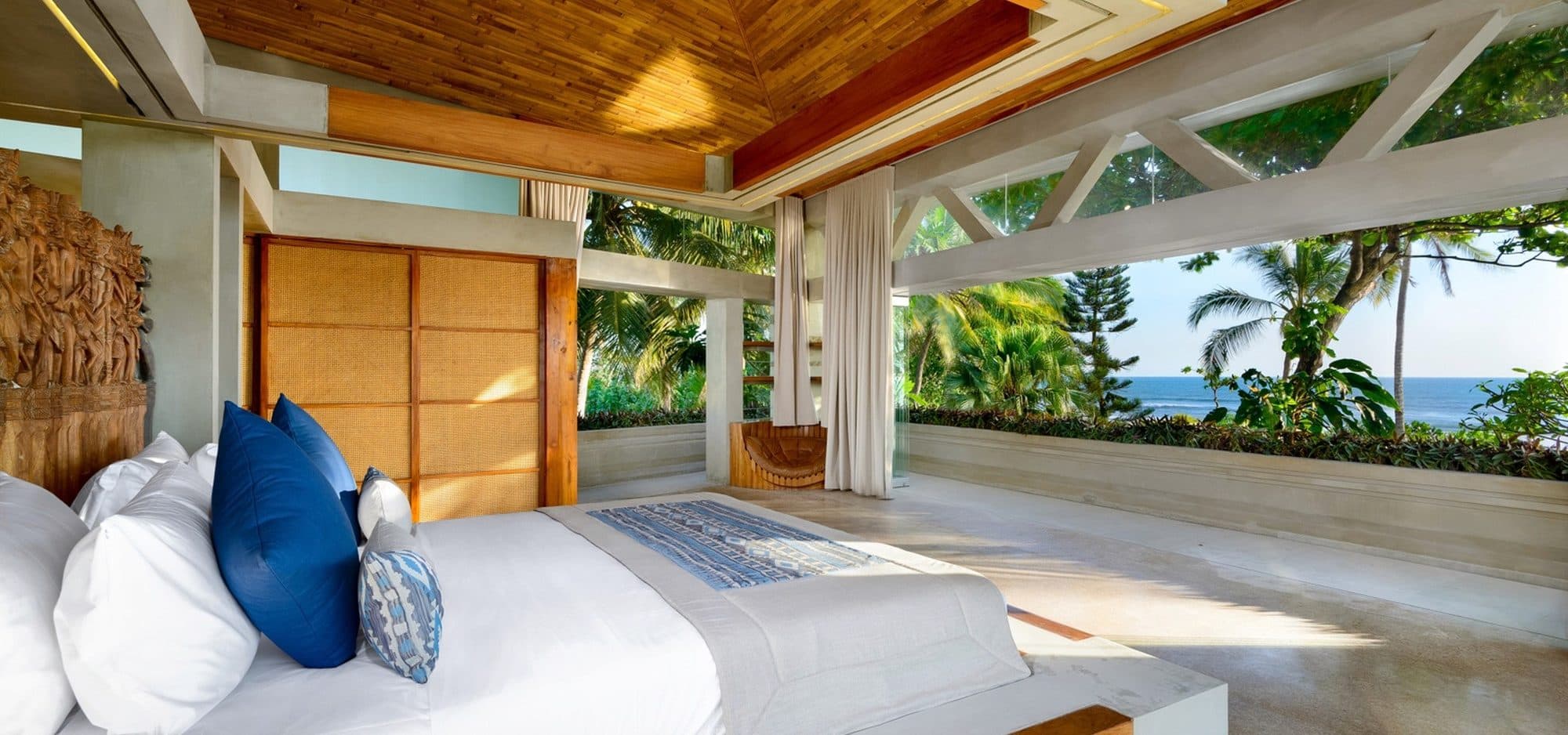 Villa Vedas — a bedroom open to the sea view · Bali, Indonesia