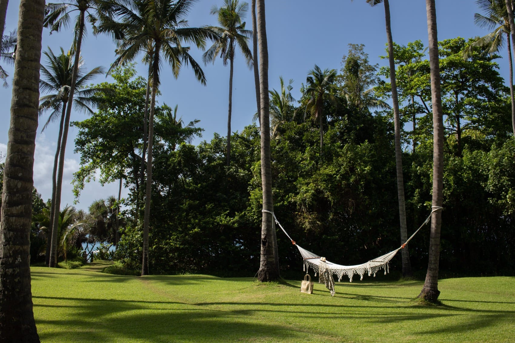A hammock in Amankila's Coconut Grove by the beach