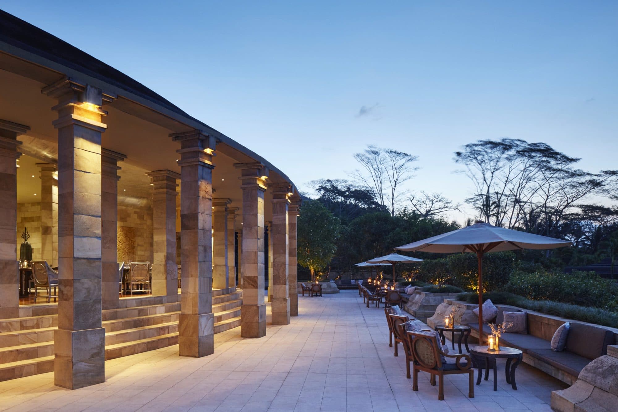 Amanjiwo — the colonnade and lounge terrace at dusk · Yogyakarta, Indonesia