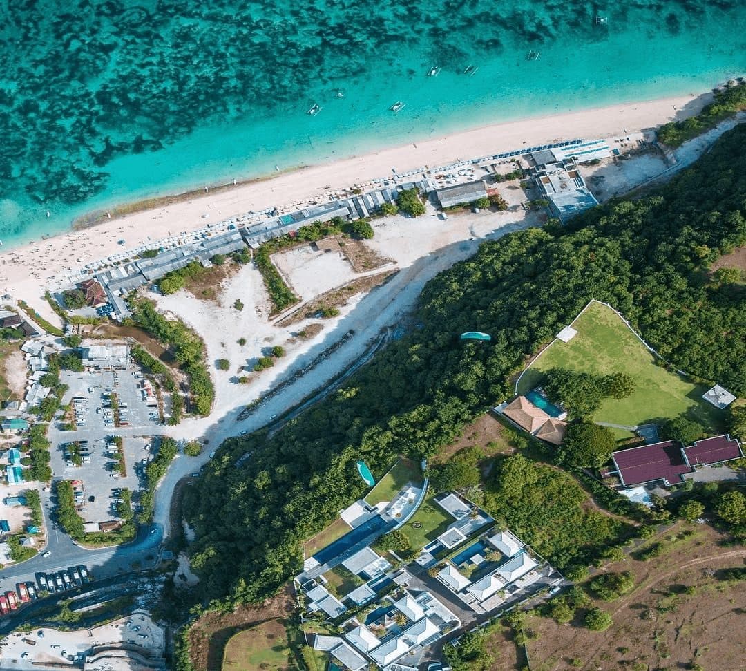 Latitude — aerial view of the clifftop villa above the beach · Ungasan, Indonesia