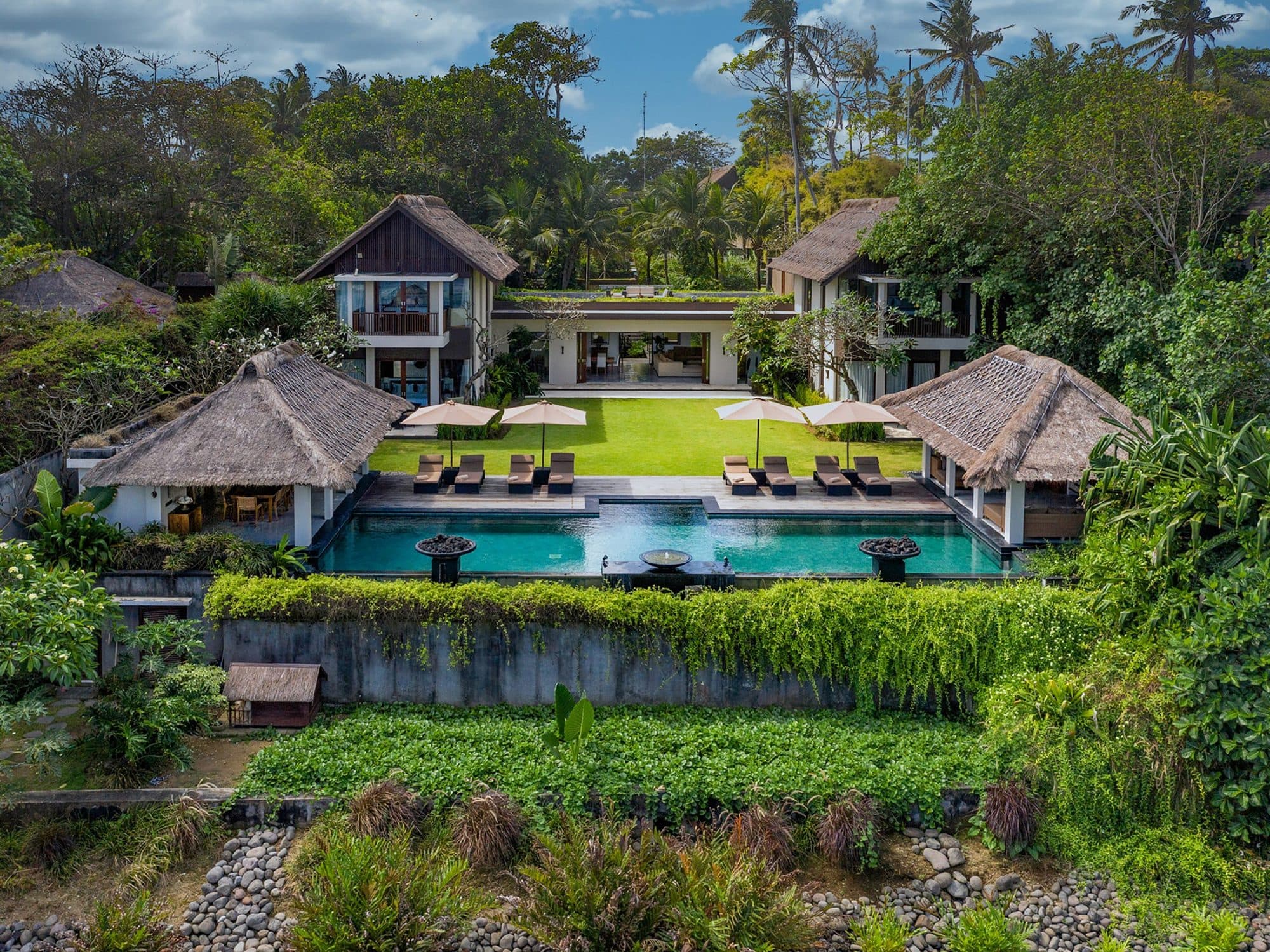 Seseh Beach Villas — aerial view of the villas, pools and gardens · Seseh, Indonesia