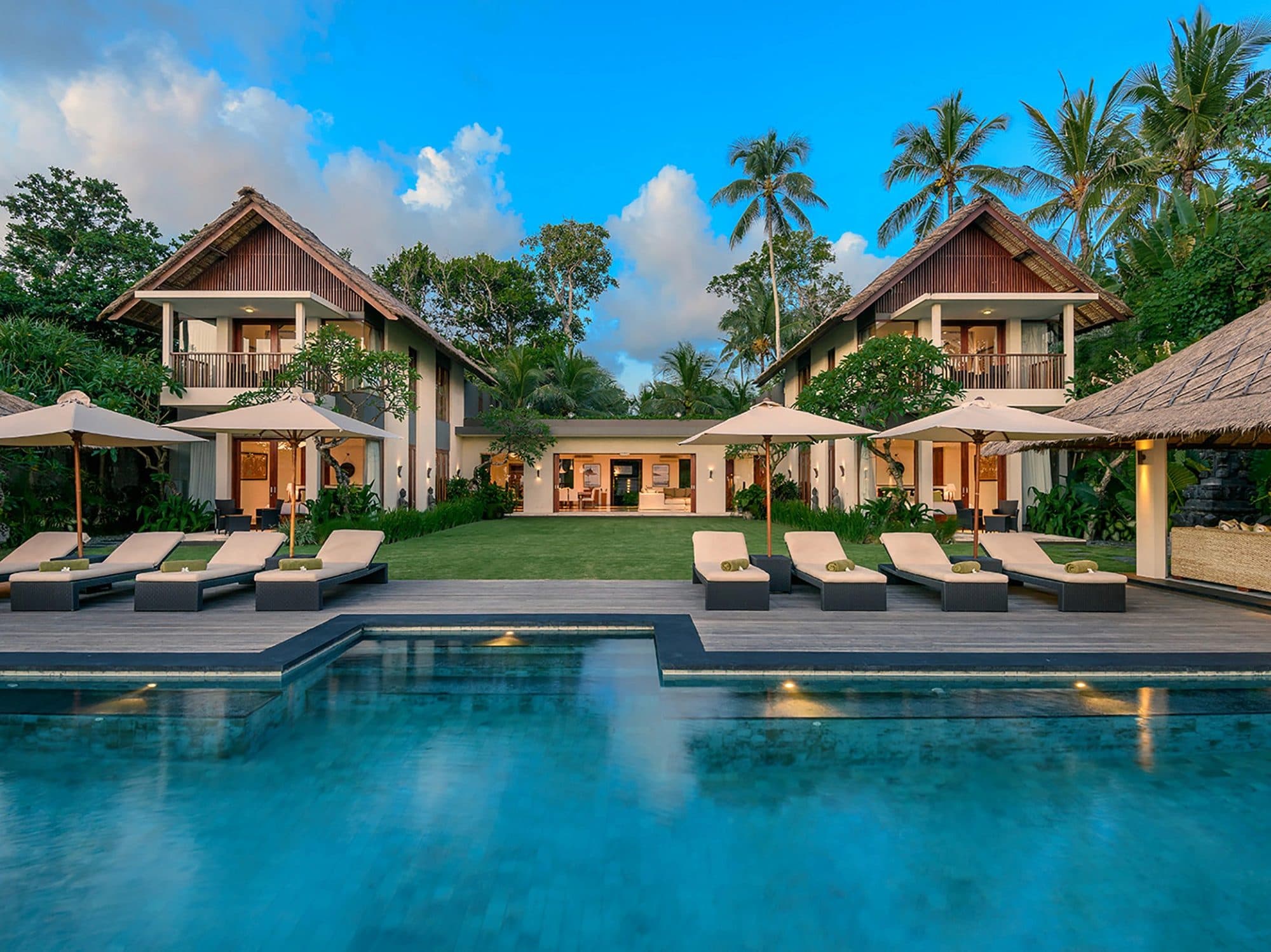 Seseh Beach Villas — the pool and loungers before the two-storey villas · Seseh, Indonesia