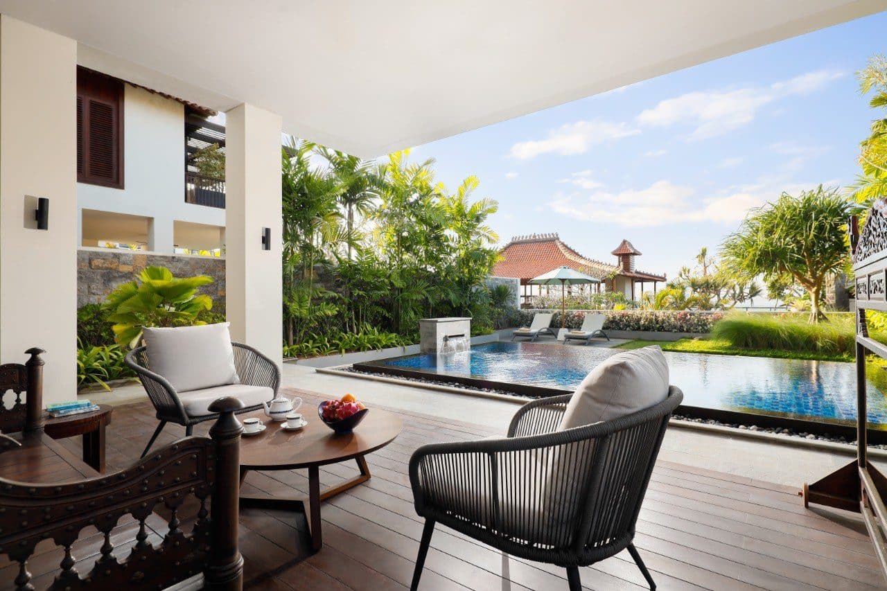 The Tulou Bali — a terrace table beside the pool · Jimbaran, Indonesia