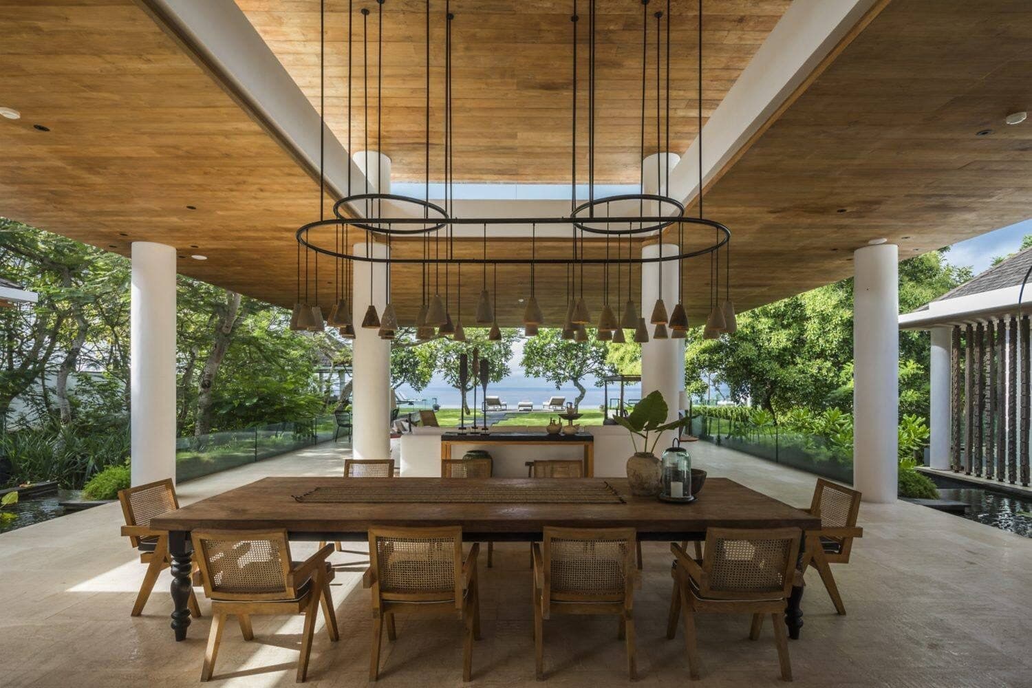 Uluwatu Estate — a long dining table under a timber ceiling · Uluwatu, Indonesia