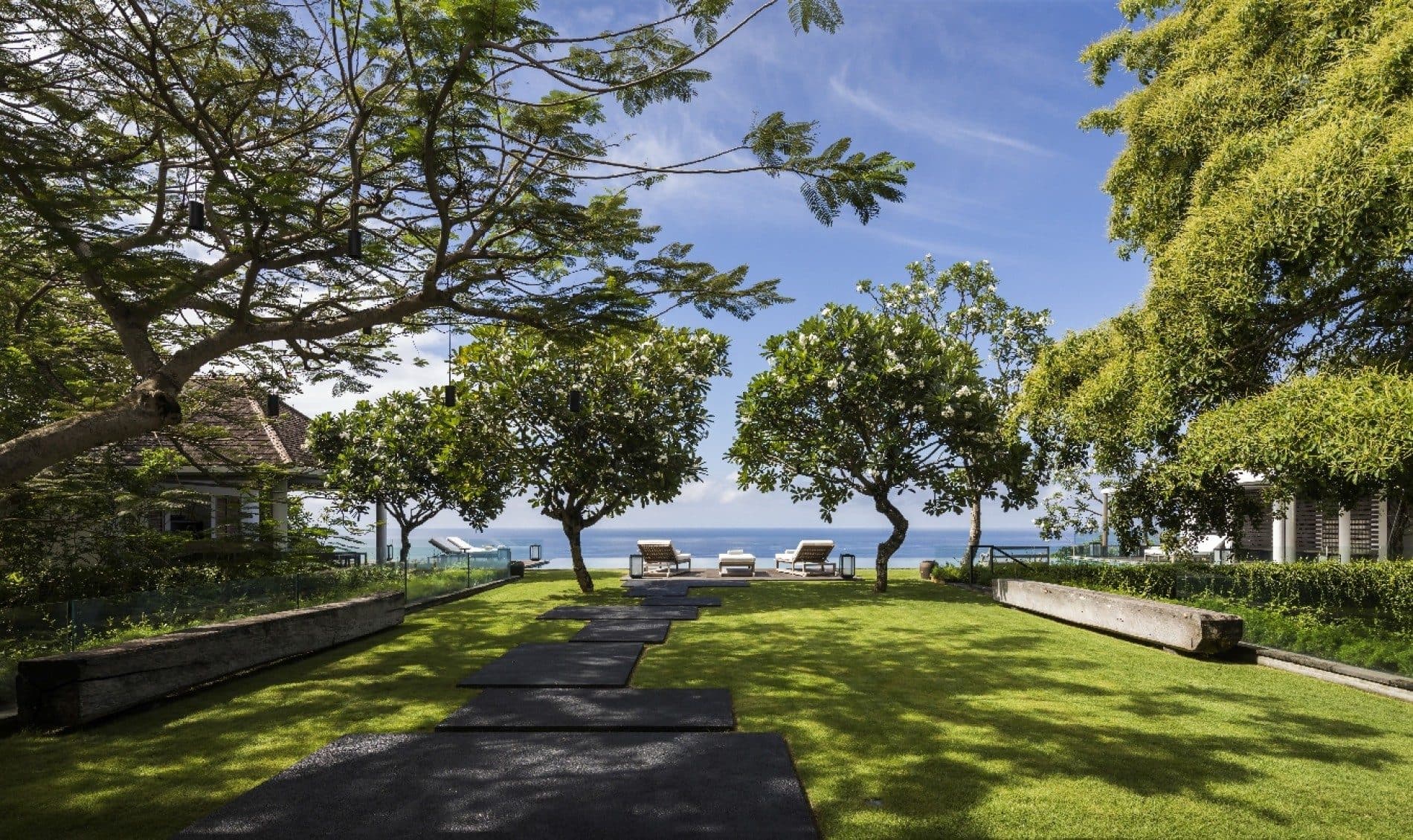 Uluwatu Estate — the lawn and path through the trees to the sea · Uluwatu, Indonesia