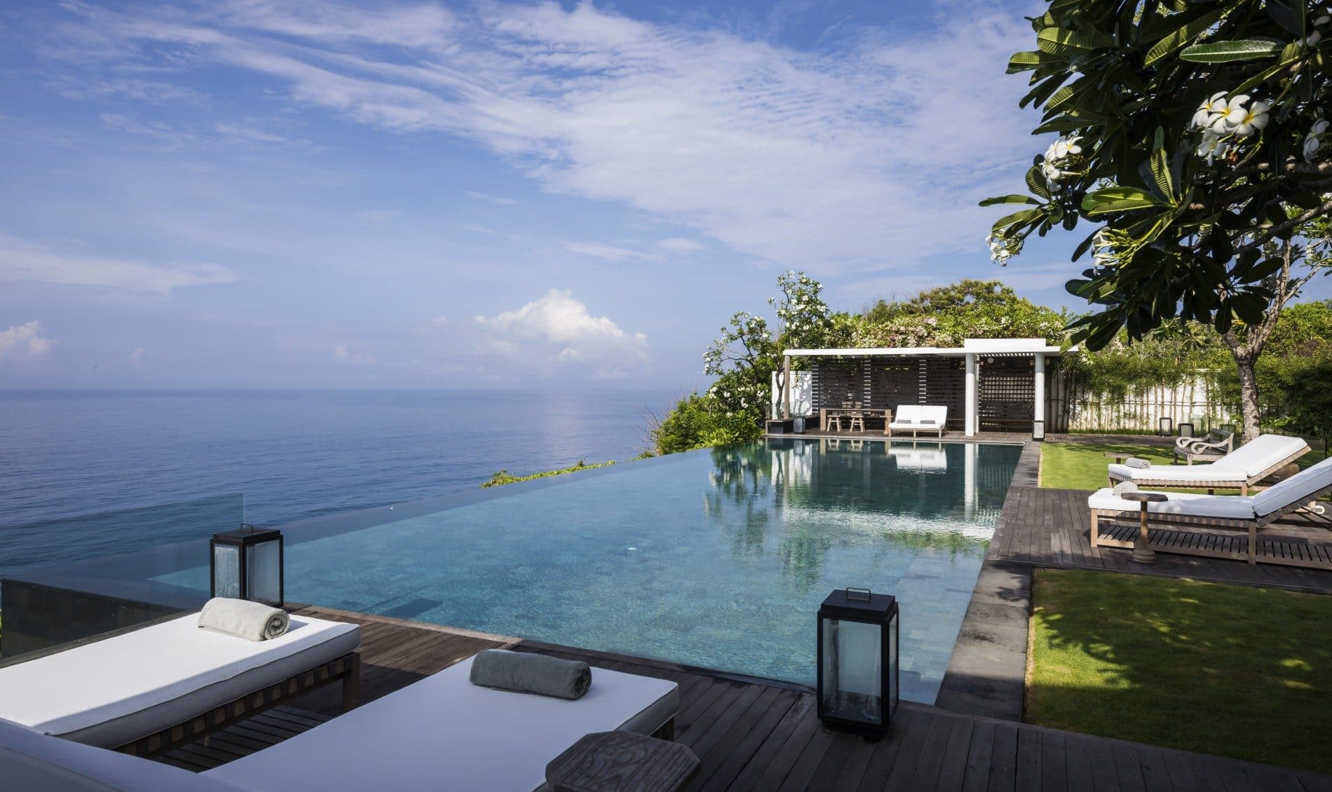 Uluwatu Estate — the infinity pool and loungers above the ocean · Uluwatu, Indonesia