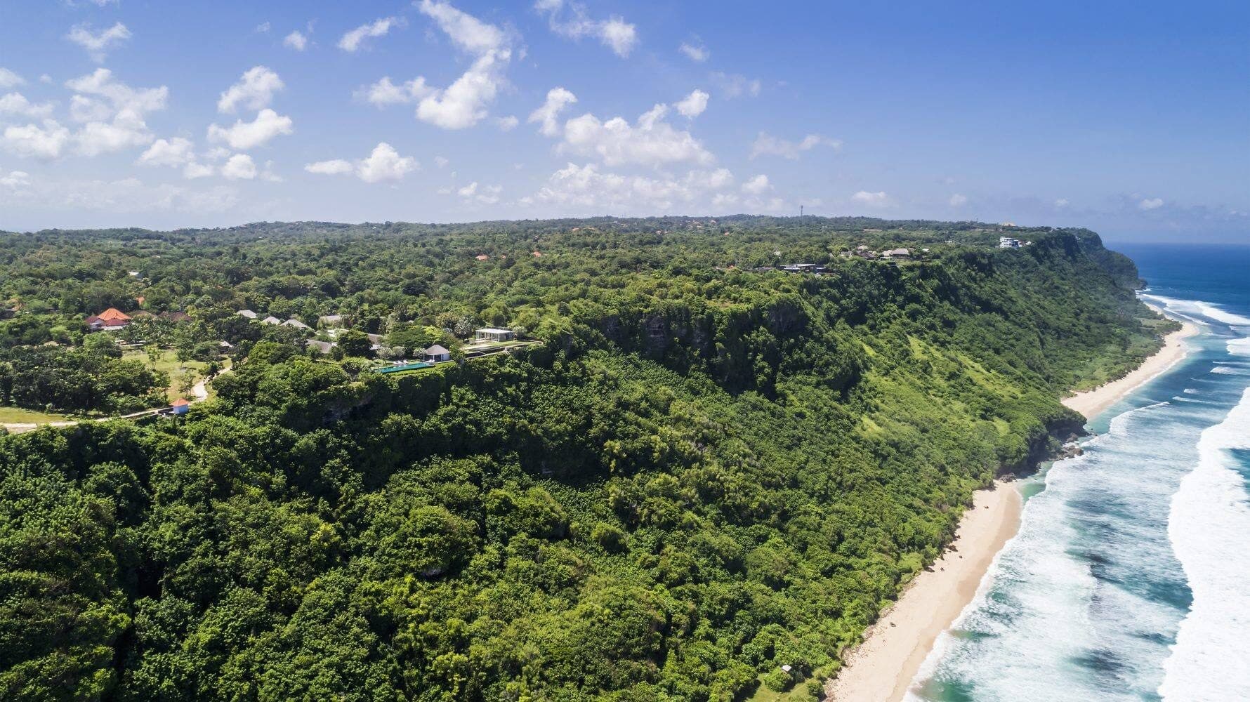 Uluwatu Estate — the clifftop coastline and beach below the estate · Uluwatu, Indonesia