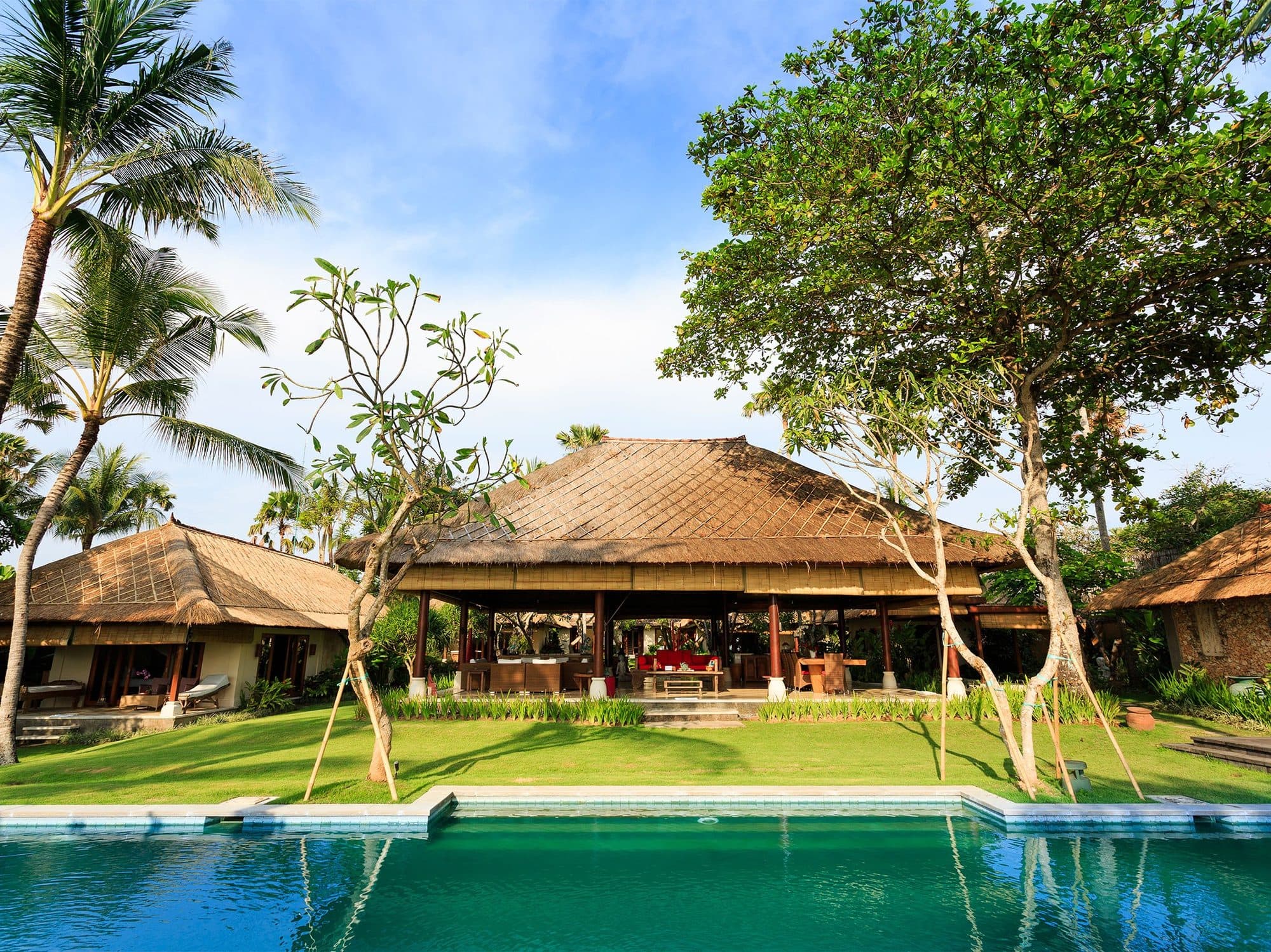Villa Maridadi — thatched pavilions behind the pool · Cemagi, Indonesia