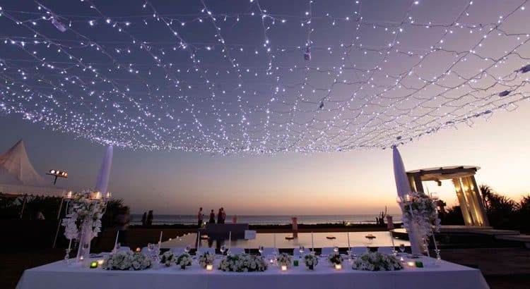 Villa Phalosa — a reception table under strings of lights at dusk · Seseh, Indonesia
