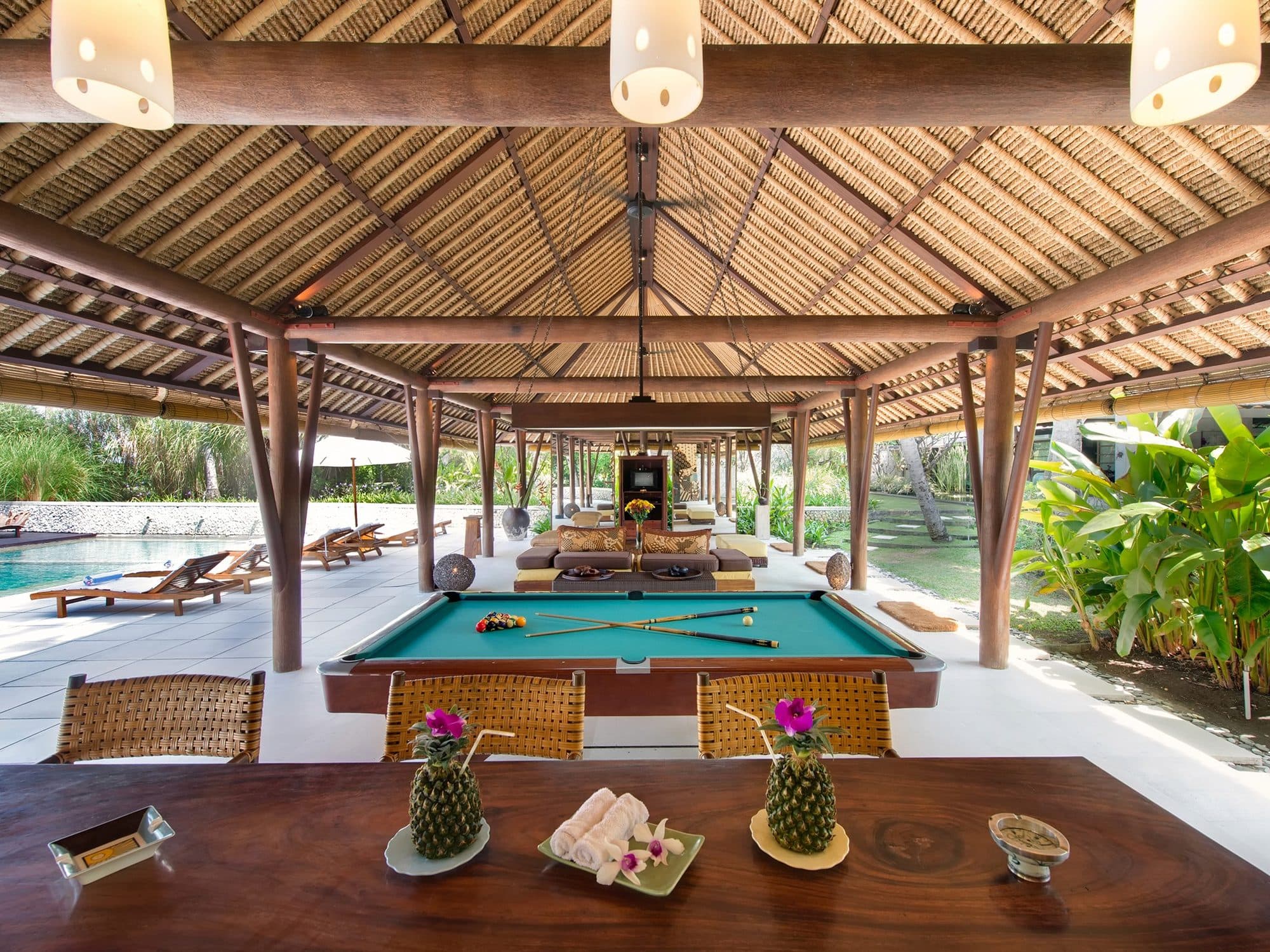 Villa Samadhana — a pool table and dining table in the open pavilion · Ketewel, Indonesia