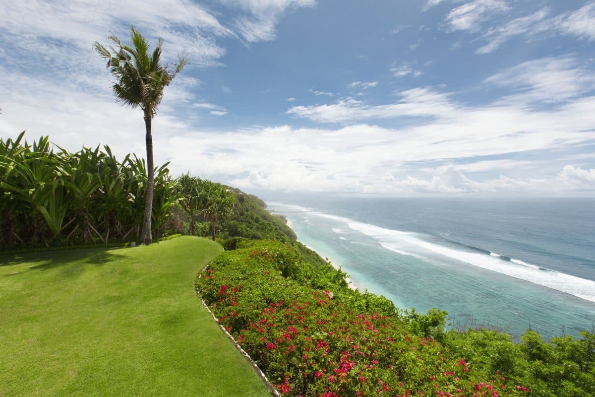 Villa Tamarama — the clifftop lawn above the beach · Bali, Indonesia