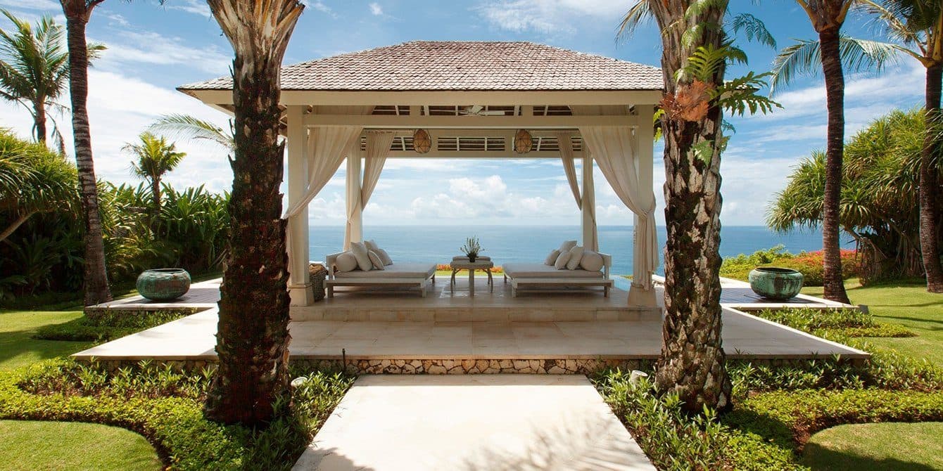 Villa Tamarama — the pool pavilion framed by palms · Bali, Indonesia